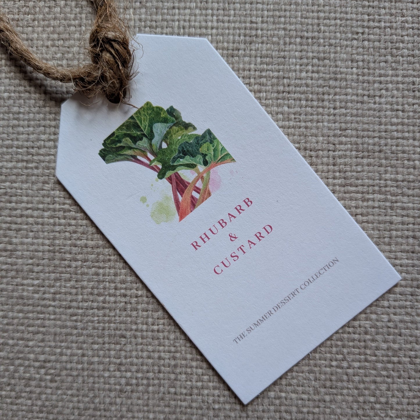 Close up of front Rhubarb and custard tag with a natural jute twine