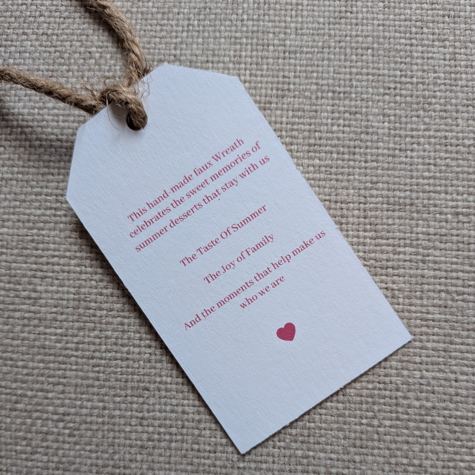 Close up of the back of the Rhubarb and Custard tag with a natural jute twine